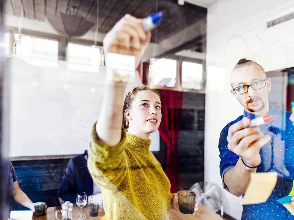 4 Tips for Using Google Ads to Market Your Med Spa 1 Creative Business People Writing on Glass Wall