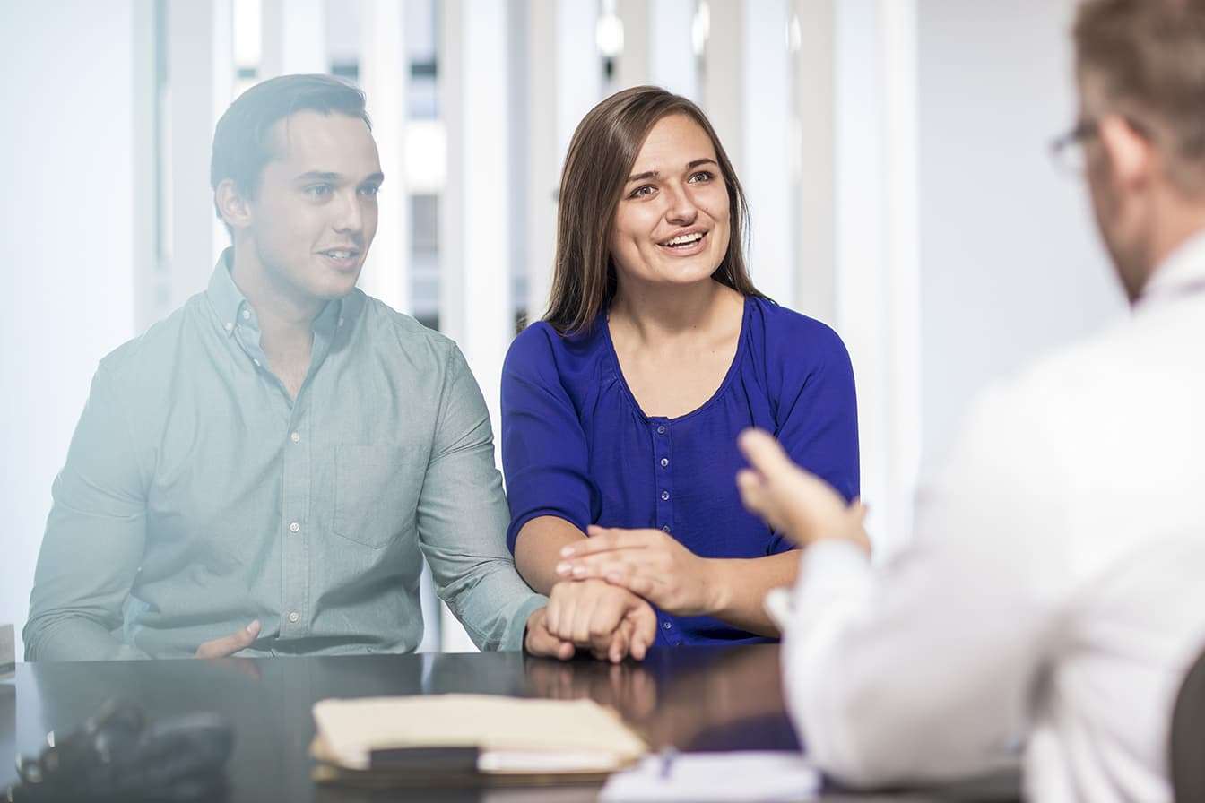 How to Scale Your Medical Practice 1 Doctor talking to couple in medical practice
